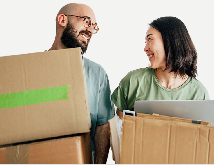 a man and woman smiling at eachother holding boxes of electronics
