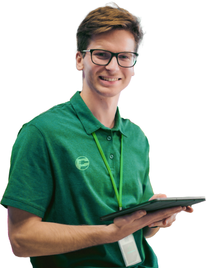 an employee holding a tablet smiling with a paymore shirt on
